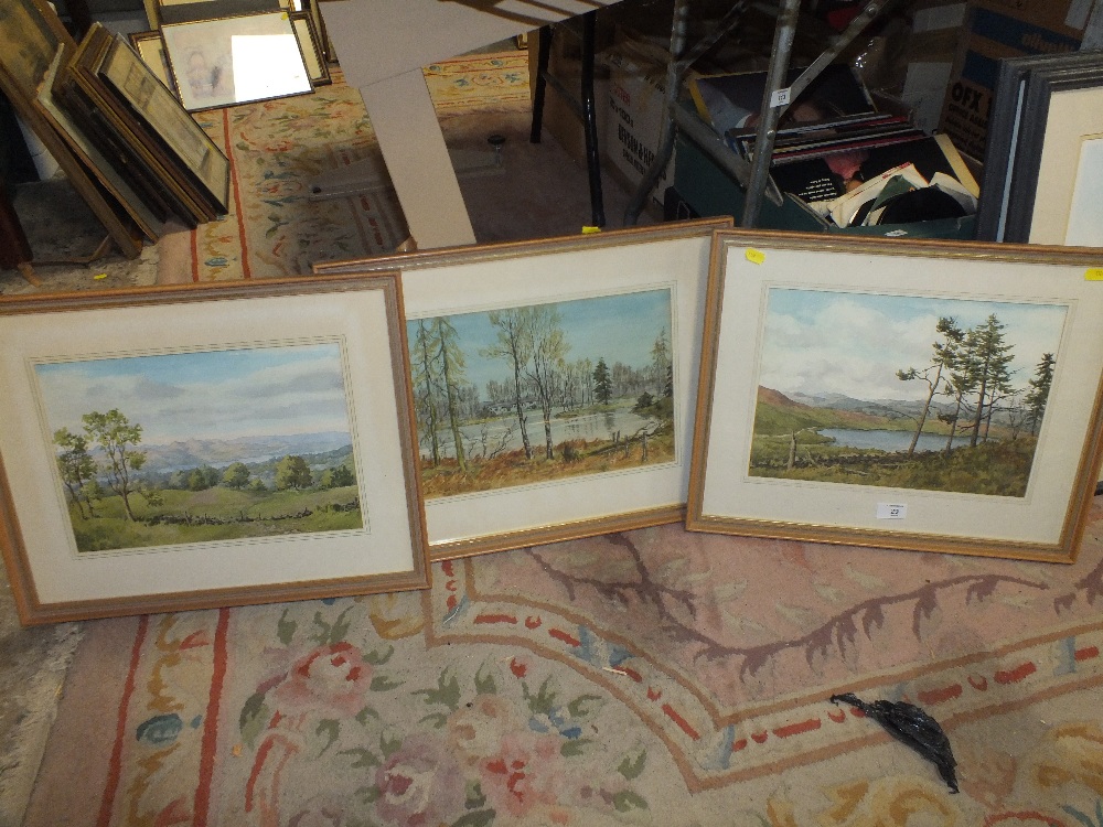 A SET OF THREE FRAMED AND GLAZED WATERCOLOURS BY ERNEST S CLARKE DEPICTING COUNTRY LANDSCAPED