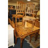 A COLONIAL DINING TABLE AND SIX CHAIRS