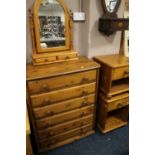 A HONEY PINE SIX DRAWER CHEST, MIRROR AND PAIR OF BEDSIDE CABINETS ( 4 )