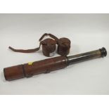 A VINTAGE LEATHER COATED BRASS TELESCOPE