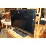 A SAMSUNG 40" FLATSCREEN TV - REMOTE - H/C