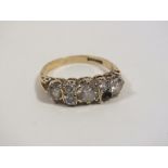 A HALLMARKED 9 CARAT GOLD SEVEN STONE RING - MINUS ONE STONE