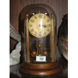 A VINTAGE GLASS DOME MANTEL CLOCK