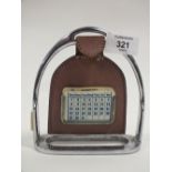 AN UNUSUAL LEATHER AND CHROME EFFECT HORSE STIRRUP CALENDAR