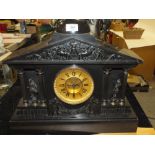 A VINTAGE SLATE COLUMNED MANTEL CLOCK