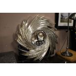 A MODERN SILVER SWIRLING WALL MIRROR