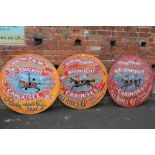 A SET OF THREE WOODEN CIRCULAR PAINTED CAROUSEL SIGNS Dia. 90 cm