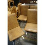 A SET OF FOUR BROWN LEATHER AND CHROMED DINNING CHAIRS