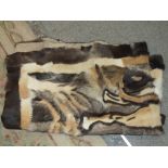 AN ANIMAL SKIN PELT/RUG