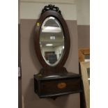 AN ANTIQUE OAK WALL MIRROR