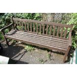 A WOODEN GARDEN BENCH