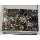 A TIN OF ASSORTED DRESS RINGS