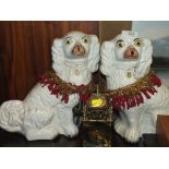 A PAIR OF LARGE STAFFORDSHIRE STYLE SPANIEL FIGURES TOGETHER WITH A SMALL CLOCK