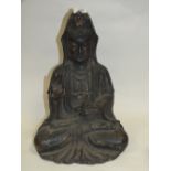 A VINTAGE BRONZE STYLE SEATED ORIENTAL ICON FIGURE
