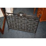 A HEAVY IRON LATTICE WORK FIRE SCREEN W - 83 CM