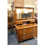 AN EDWARDIAN MAHOGANY DRESSING TABLE WITH A BEDFRAME