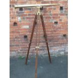 A LARGE VINTAGE BRASS TELESCOPE ON WOODEN STAND