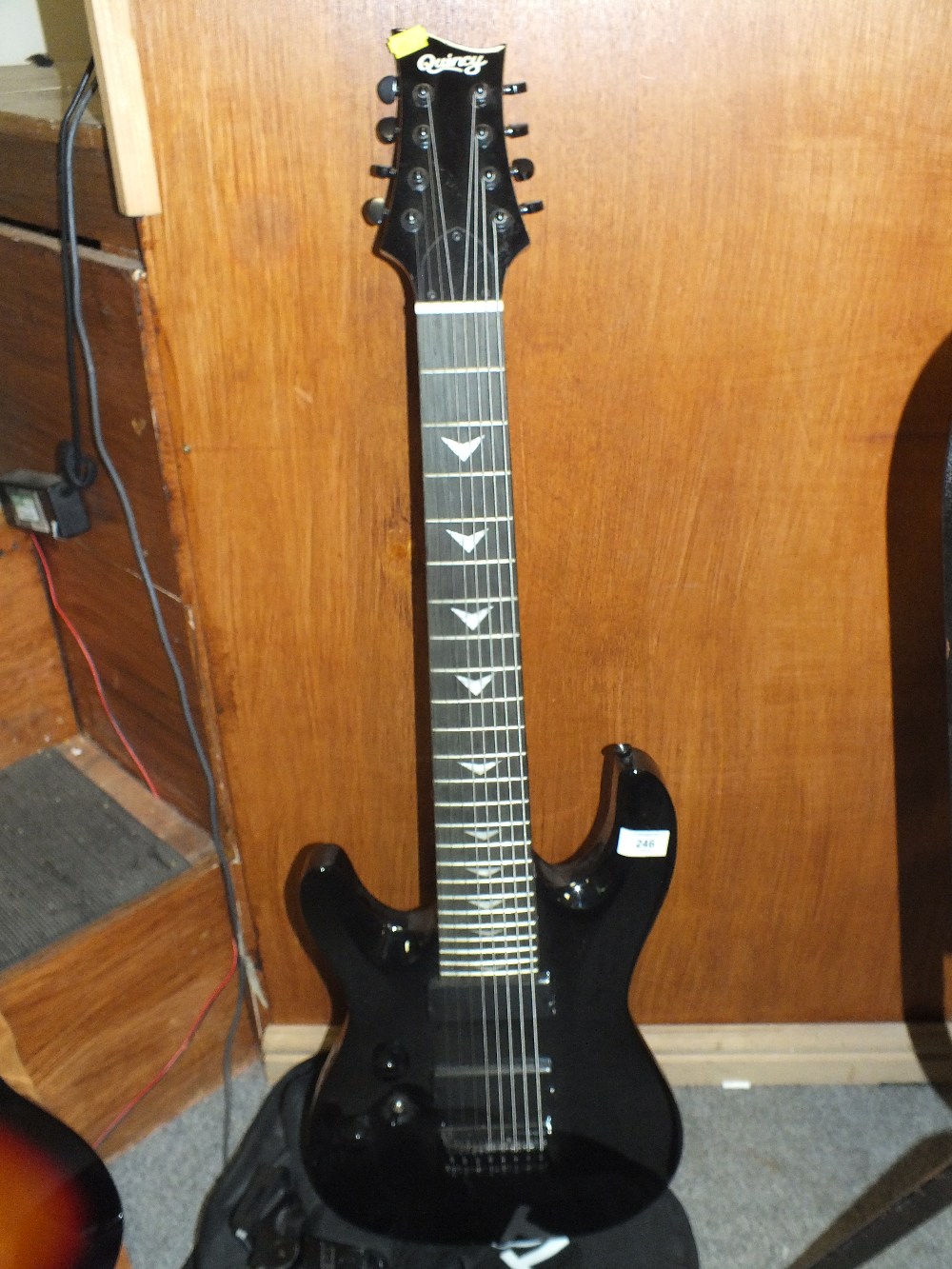 A QUINCY EIGHT STRING LEFT HANDED ELECTRIC GUITAR