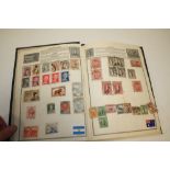 AN ALBUM OF VINTAGE STAMPS