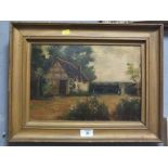 A GILT FRAMED OIL ON CANVAS DEPICTING A RUSTIC COTTAGE SCENE SIGNED F WALTERS