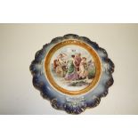 A CONTINENTAL STYLE FIGURATIVE WALL HANGING CERAMIC PLAQUE