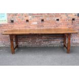 AN ANTIQUE PROVINCIAL FRENCH ELM REFECTORY TABLE, of typical construction the two plank top