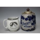 A BUCHANAN'S BLACK AND WHITE SCOTCH WHISKY JUG, H 11 cm, together with a 'Thorne's' whisky barrel