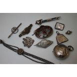 A COLLECTION OF VINTAGE SILVER AND WHITE METAL JEWELLERY, comprising a collection of brooches to