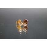 A PAIR OF 18 CARAT GOLD DIAMOND STUDS, the diamonds being an estimated quarter carat each