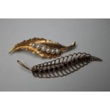 TWO 9CT GOLD AND GEM SET LEAF DESIGN BROOCHES, largest W 6.2 cm, combined approximate weight 9.1