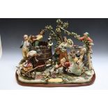 A LARGE CAPO DI MONTE LIMITED FIGURE OF A FAMILY PRESSING THE GRAPE HARVEST, number 407 of 500, W 58