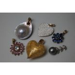 A SELECTION OF 9CT GOLD PENDANTS, to include a heart shaped Murano glass example, a mother of