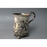 A DECORATIVE EARLY VICTORIAN HALLMARKED SILVER MUG, decorated with a cottage scene and a person