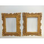 A PAIR OF 20TH CENTURY CARVED WOODEN DECORATIVE GILT FRAMES, rebate 12 x 9 cm, frame W 3 cm