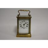 A SMALL BRASS CASED DUVERDREY & BLOQUEL CARRIAGE CLOCK, the enamel dial with Roman numerals, the