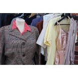 A COLLECTION OF EARLY TO MID 20TH CENTURY LADIES CLOTHING, to include a selection of blouses, two-