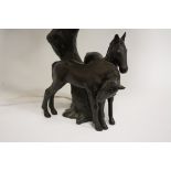 A BRONZED TABLE LAMP IN THE FORM OF TWO FOALS BY A TREE TRUNK, marked Foreign to base, H 37 cm to