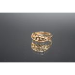 A HALLMARKED 18 CARAT GOLD FIVE STONE DIAMOND RING, ring size M