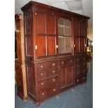 A LARGE 19TH CENTURY PITCH PINE HOUSEKEEPERS CUPBOARD, the upper section with three sliding doors,