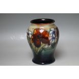 A FLORAL MOORCROFT VASE, H 15.5 cm