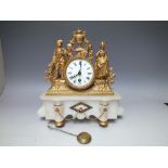 A FRENCH GILT METAL AND WHITE ALABASTER DECORATIVE MANTLE CLOCK, the circular enamel dial with Roman