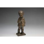 A SMALL BRONZE FIGURE OF A SCHOOLBOY, H 21.5 cm