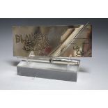 A GENUINE SILVER PLATED BLANKETY BLANK CHEQUE BOOK AND PEN, from the Lily Savage series, the 'Cross'