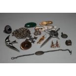 A COLLECTION OF VINTAGE SILVER AND COSTUME JEWELLERY, comprising eight brooches of varying styles