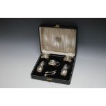 A CASED HALLMARKED FIVE PIECE SILVER CRUET SET BY ADIE BROS - BIRMINGHAM 1941, together with three