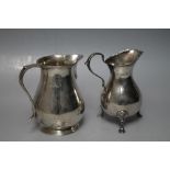 TWO HALLMARKED SILVER CREAM JUGS, one being London 1961, the other a footed example - London 1909,