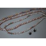 TWO MODERN CULTURED PEARL NECKLACES, varying in style, colour and length, one clasp stamped 375, the