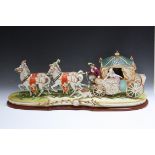 A LARGE LIMITED EDITION CAPO DI MONTE FIGURE OF A COACH AND HORSES, number 36 of 750, W 85 cm