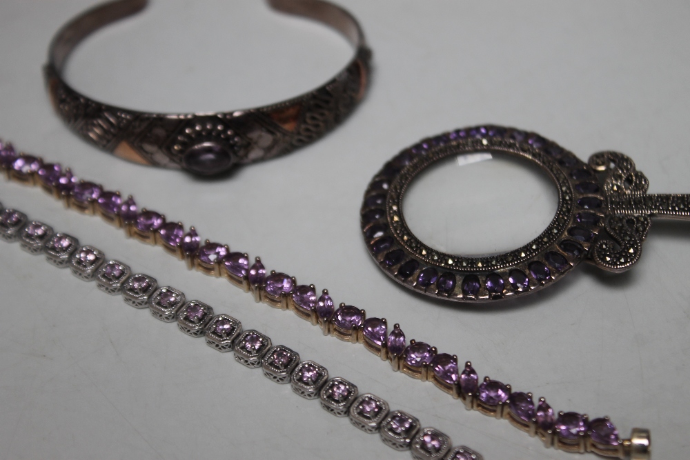 A COLLECTION OF SILVER AND AMETHYST JEWELLERY, comprising an unusual pendant eyeglass stamped 925