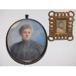 (XIX-XX). Oval portrait miniature of a lady in a black dress, indistinctly signed middle right,